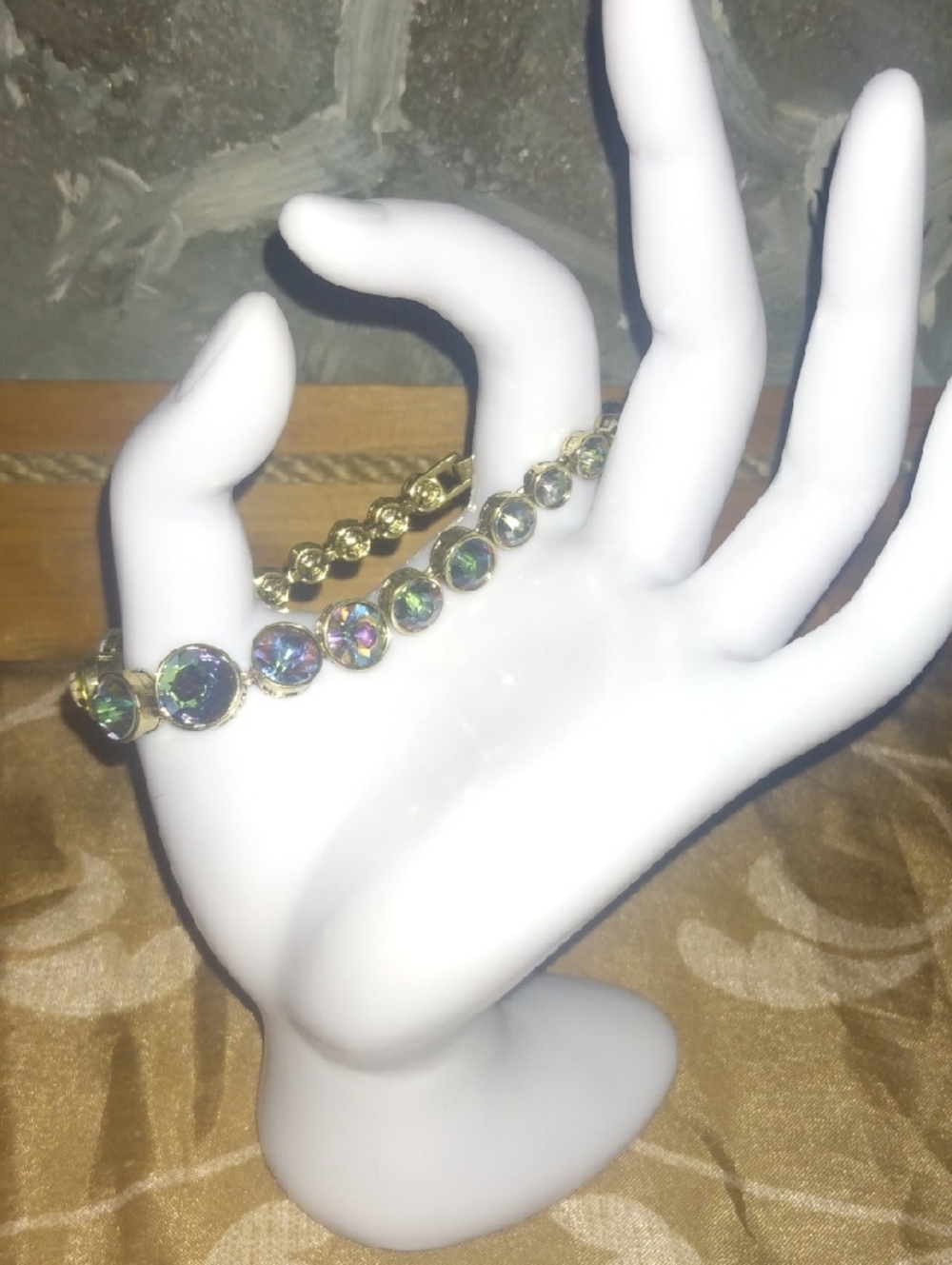 Heidi Daus Gold  Colored Bracelet with Iridescent Green-Purple Stones